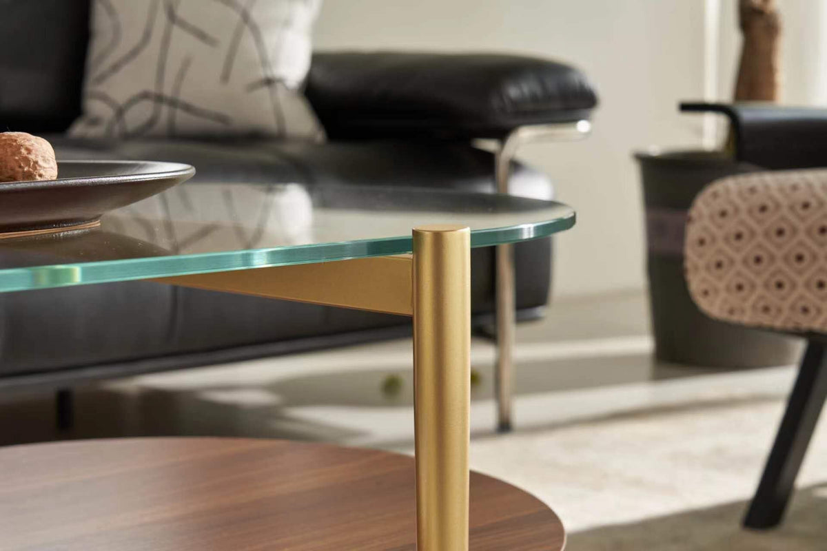 Shrine Oval Coffee Table, Mid-Century Modern Design, 2-Tier Structure, Clear Glass Top and White MDF Shelf, 47" D x 21" W x 17" H, Sleek Conical Metal Legs with Gold Finish