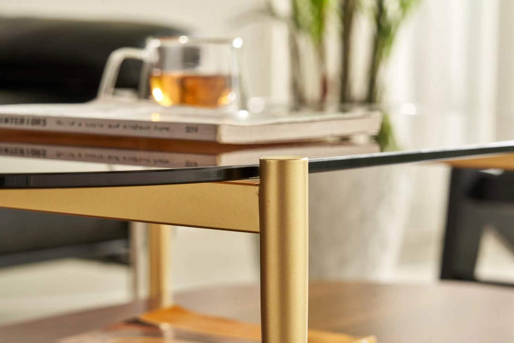 Shrine Oval Coffee Table, Mid-Century Modern Design, 2-Tier Structure, Clear Glass Top and White MDF Shelf, 47" D x 21" W x 17" H, Sleek Conical Metal Legs with Gold Finish