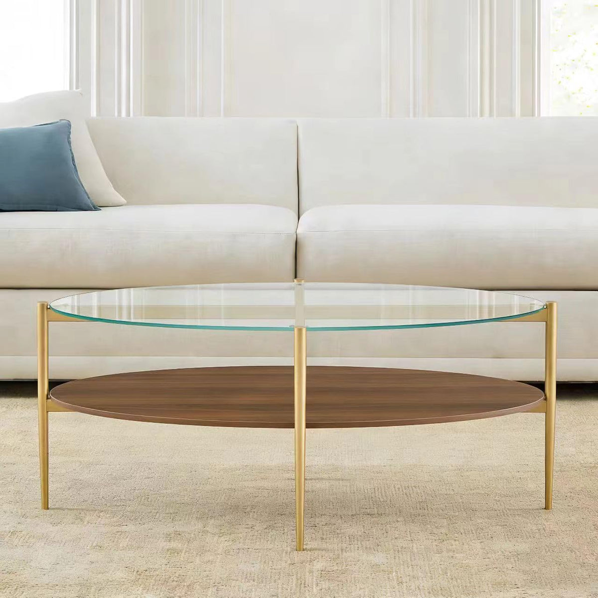 Shrine Oval Coffee Table, Mid-Century Modern Design, 2-Tier Structure, Clear Glass Top and White MDF Shelf, 47" D x 21" W x 17" H, Sleek Conical Metal Legs with Gold Finish
