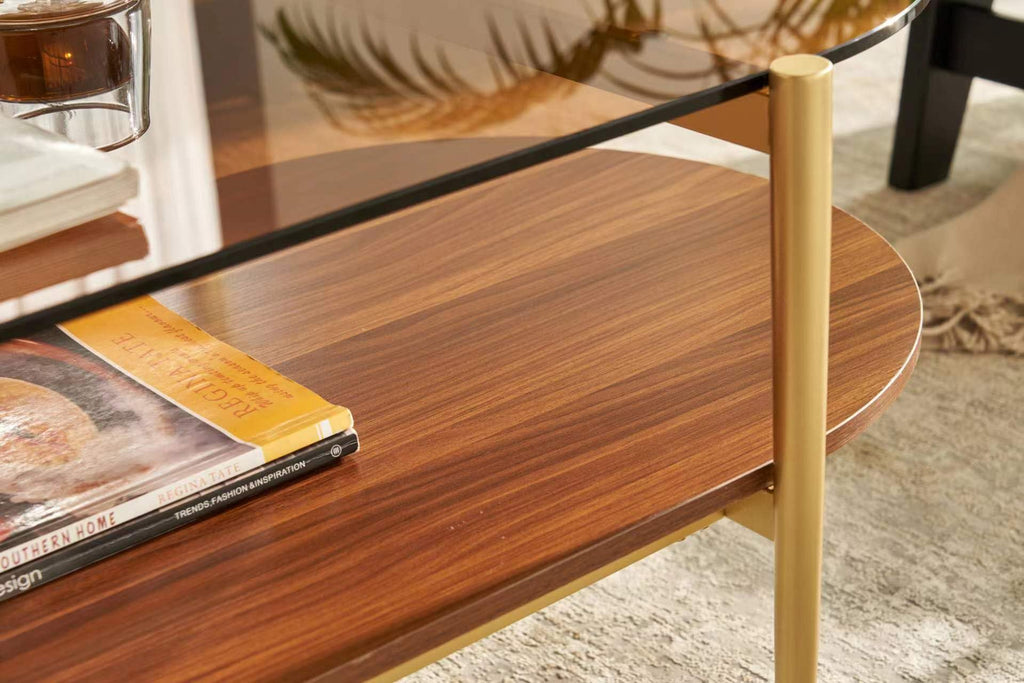 Shrine Oval Coffee Table, Mid-Century Modern Design, 2-Tier Structure, Clear Glass Top and White MDF Shelf, 47" D x 21" W x 17" H, Sleek Conical Metal Legs with Gold Finish