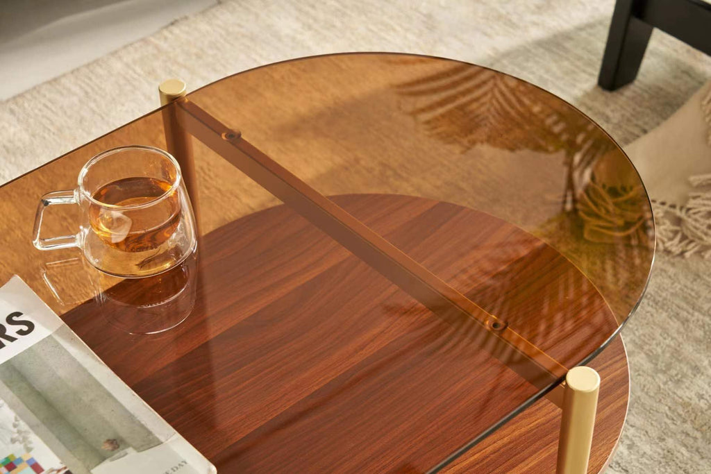 Shrine Oval Coffee Table, Mid-Century Modern Design, 2-Tier Structure, Clear Glass Top and White MDF Shelf, 47" D x 21" W x 17" H, Sleek Conical Metal Legs with Gold Finish
