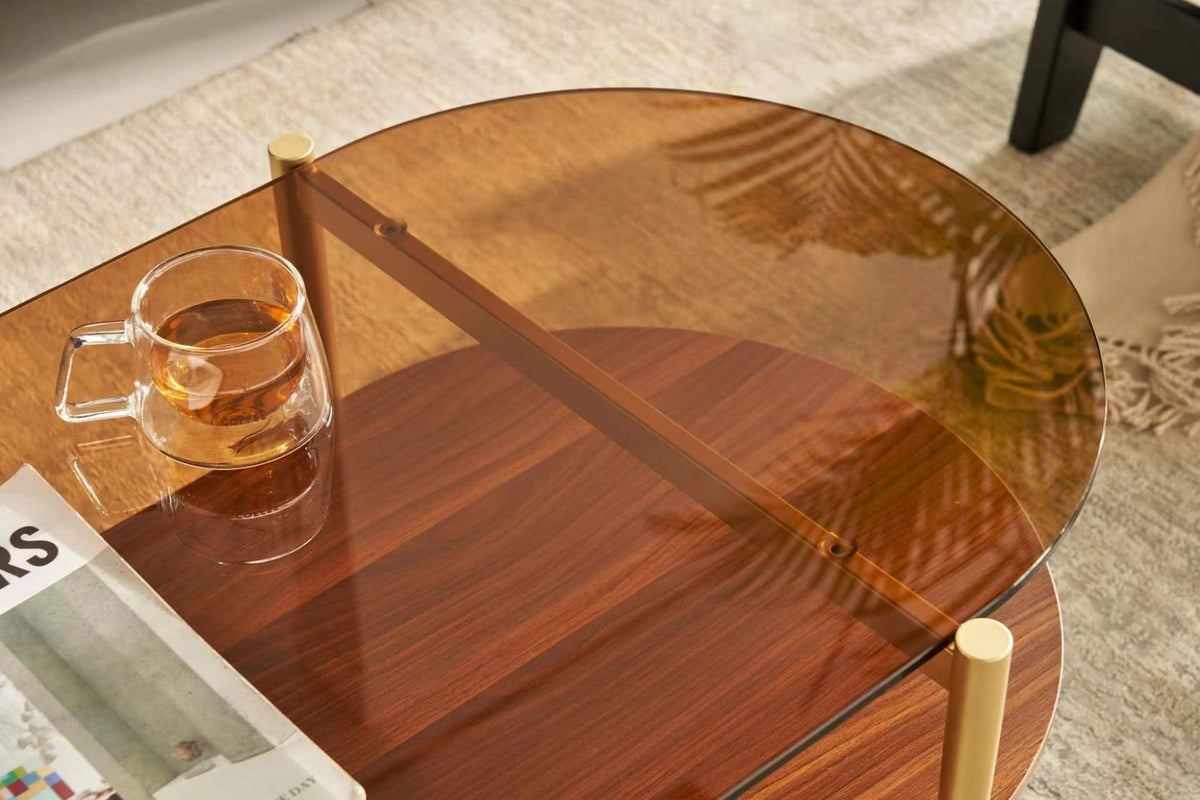 Shrine Oval Coffee Table, Mid-Century Modern Design, 2-Tier Structure, Clear Glass Top and White MDF Shelf, 47" D x 21" W x 17" H, Sleek Conical Metal Legs with Gold Finish