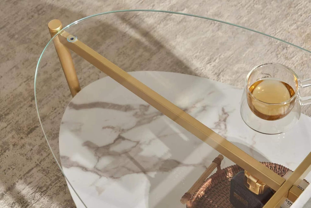 Shrine Oval Coffee Table, Mid-Century Modern Design, 2-Tier Structure, Clear Glass Top and White MDF Shelf, 47" D x 21" W x 17" H, Sleek Conical Metal Legs with Gold Finish