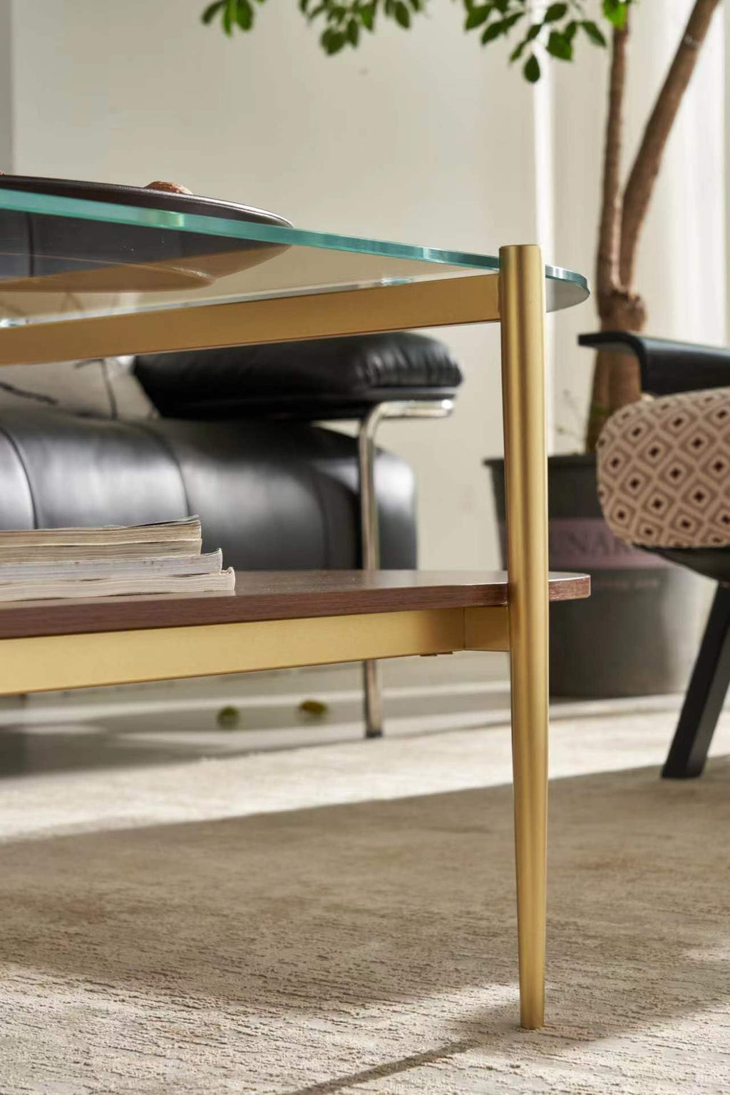 Shrine Oval Coffee Table, Mid-Century Modern Design, 2-Tier Structure, Clear Glass Top and White MDF Shelf, 47" D x 21" W x 17" H, Sleek Conical Metal Legs with Gold Finish