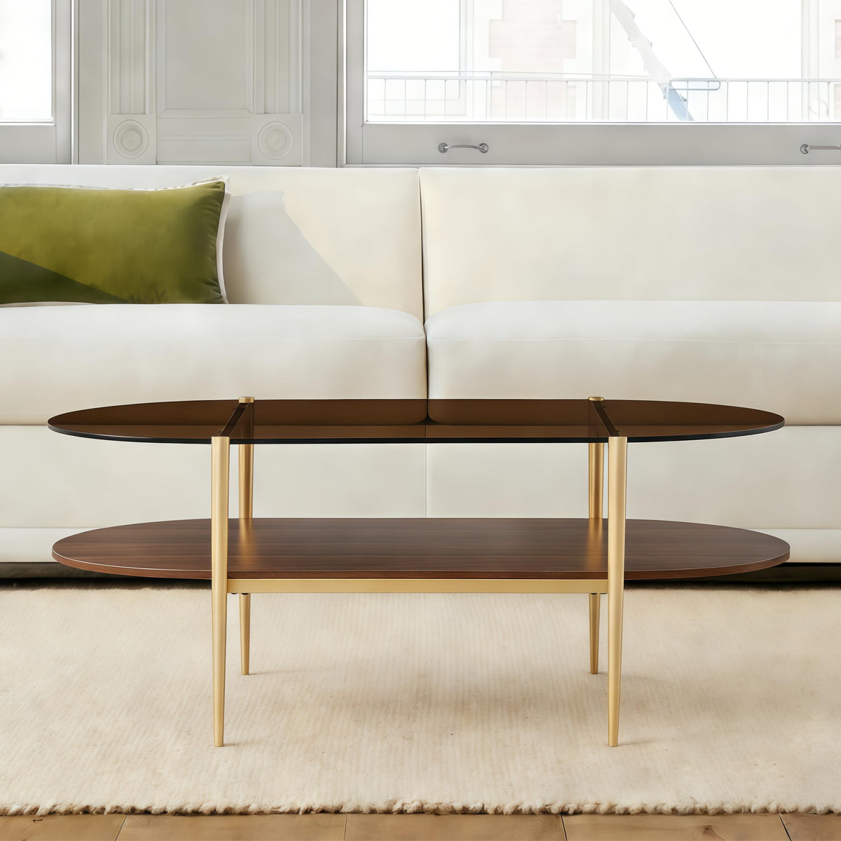 Shrine Oval Coffee Table, Mid-Century Modern Design, 2-Tier Structure, Clear Glass Top and White MDF Shelf, 47" D x 21" W x 17" H, Sleek Conical Metal Legs with Gold Finish
