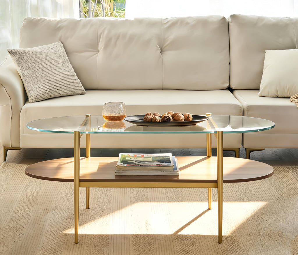Shrine Oval Coffee Table, Mid-Century Modern Design, 2-Tier Structure, Clear Glass Top and White MDF Shelf, 47" D x 21" W x 17" H, Sleek Conical Metal Legs with Gold Finish
