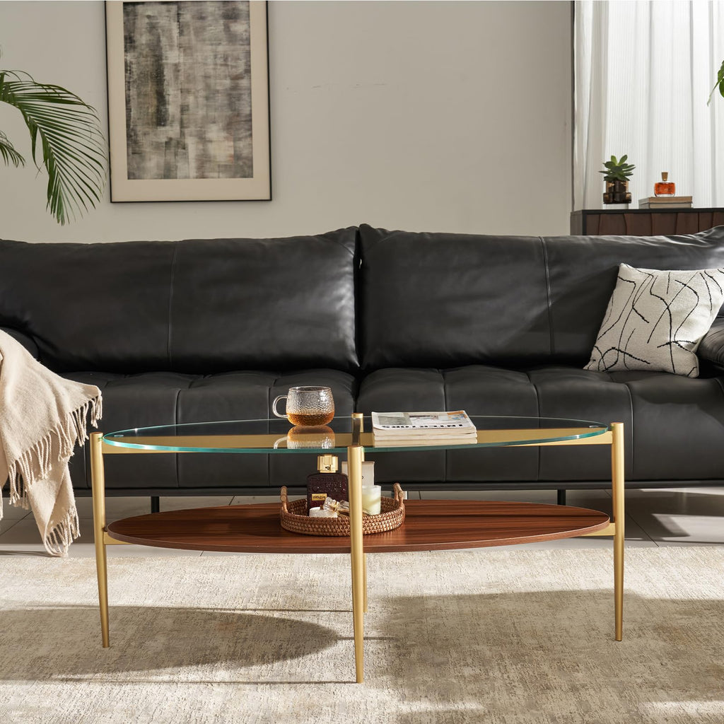 Shrine Oval Coffee Table, Mid-Century Modern Design, 2-Tier Structure, Clear Glass Top and White MDF Shelf, 47" D x 21" W x 17" H, Sleek Conical Metal Legs with Gold Finish