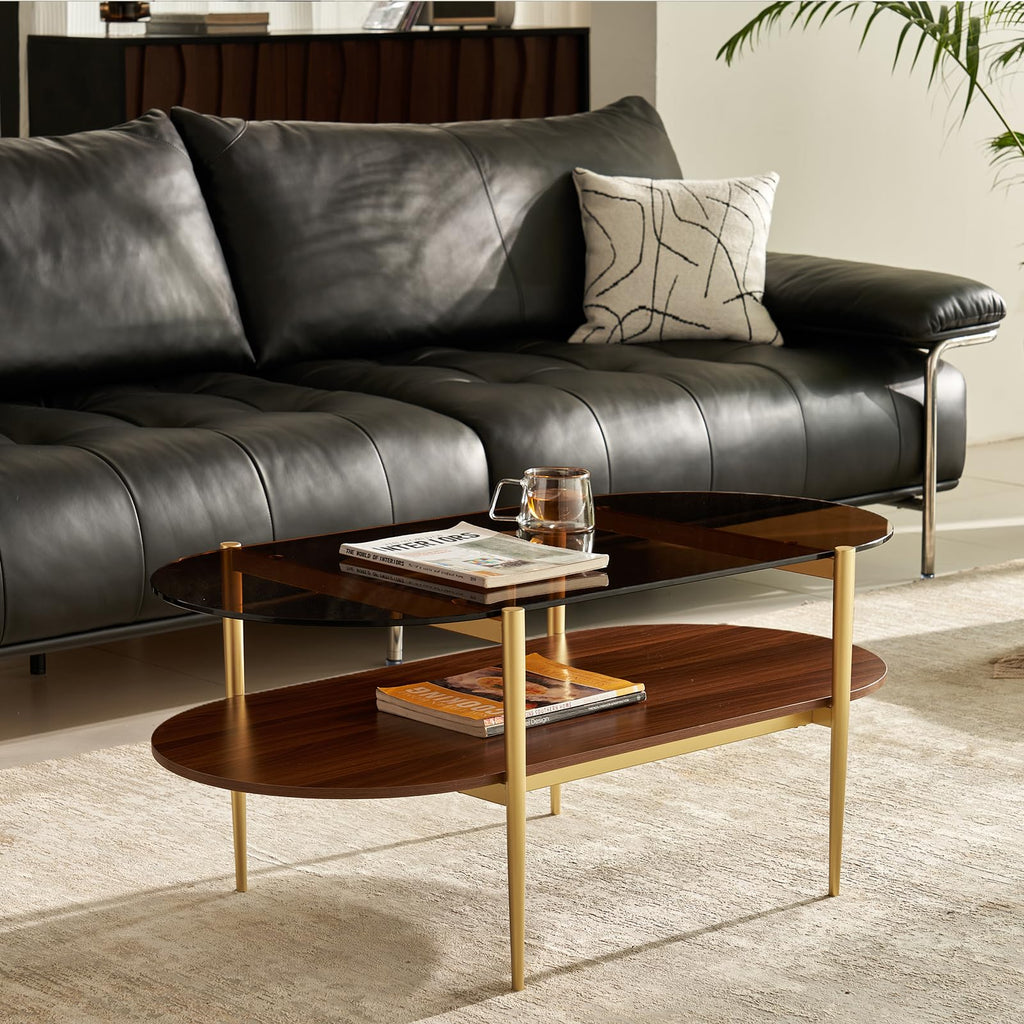 Shrine Oval Coffee Table, Mid-Century Modern Design, 2-Tier Structure, Clear Glass Top and White MDF Shelf, 47" D x 21" W x 17" H, Sleek Conical Metal Legs with Gold Finish
